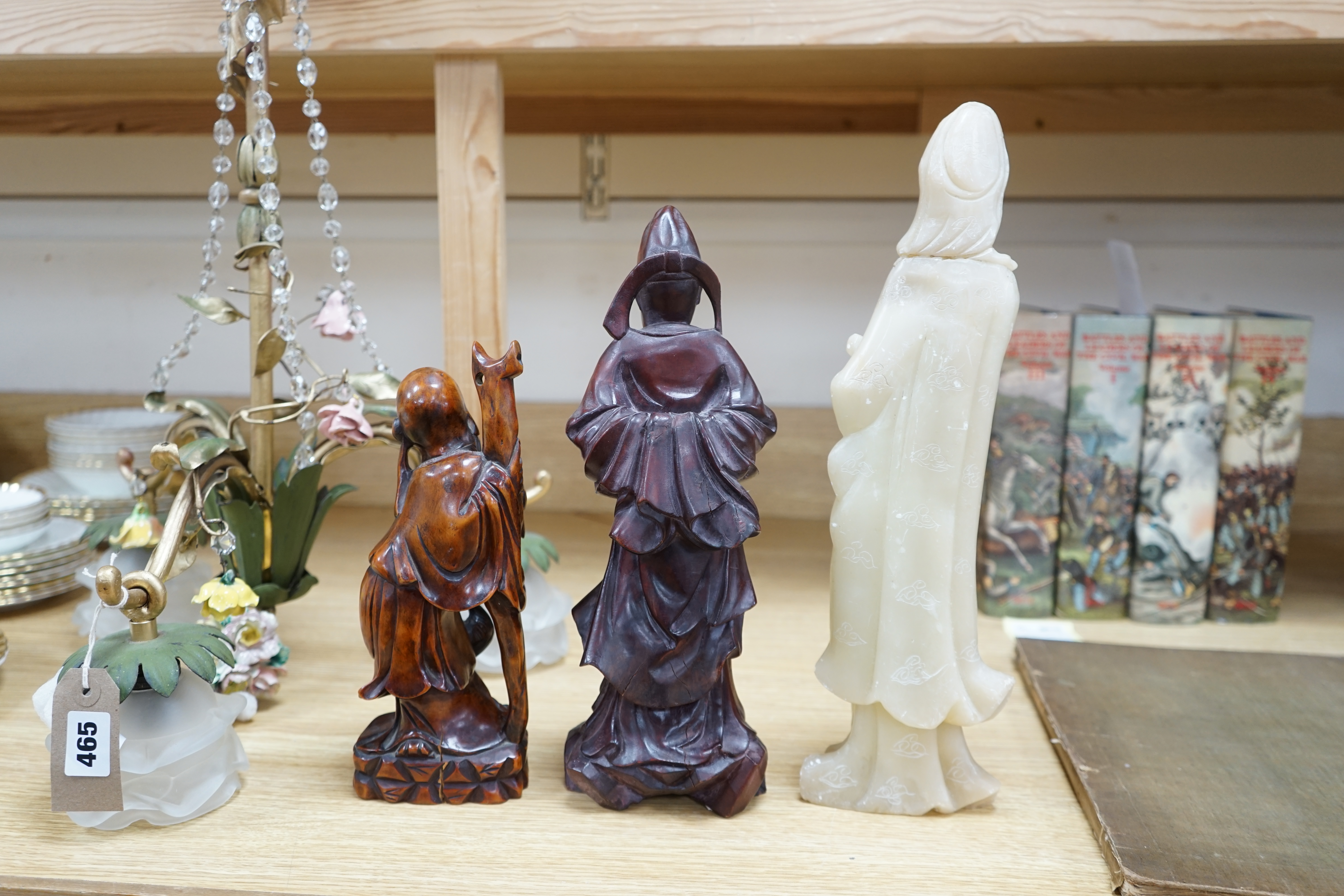 Two Chinese hardwood carved figures and a soapstone figure of Guanyin, largest 37cm high. Condition - fair